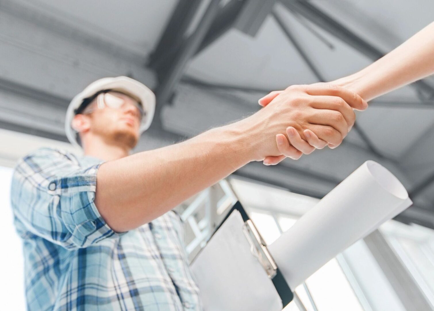 Engineer Shaking Hand With Other Person